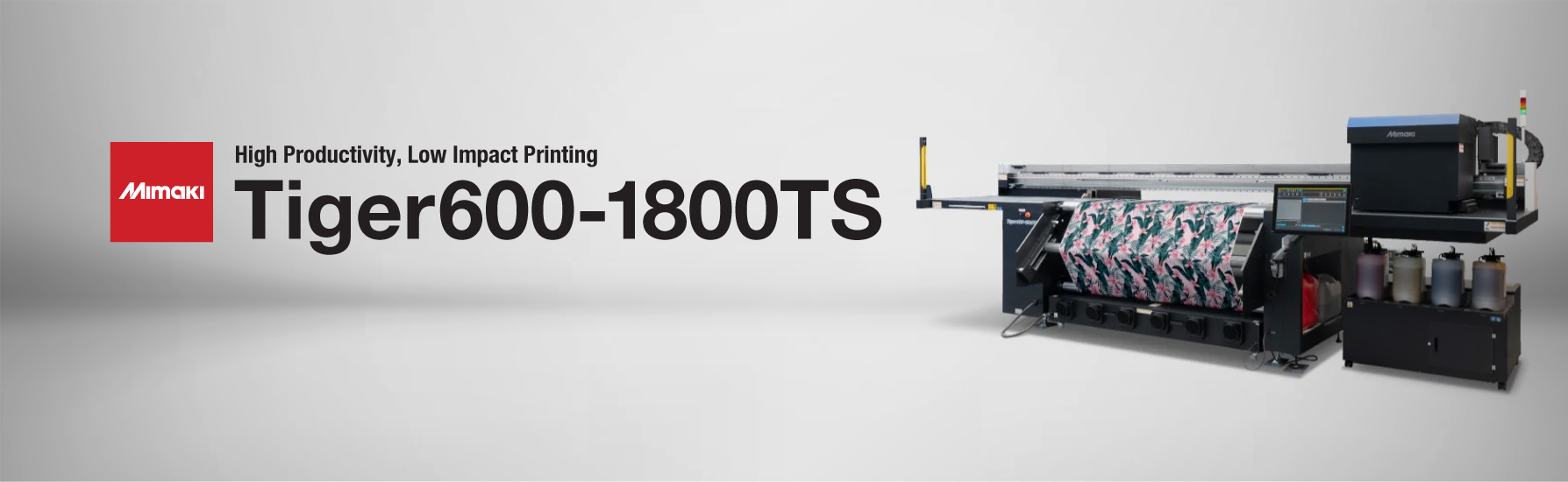 Mimaki Tiger600-1800TS 74-inch dye-sublimation printer producing vibrant textile transfers at speeds up to 550 m²/h—featuring 8 staggered printheads, MAPS4 anti-banding, ink degassing, and OEKO-TEX®/bluesign®-approved MLSb510 inks. Ideal for high-volume production of sportswear, fashion, soft signage, and interior décor with sustainable, waterless printing technology.