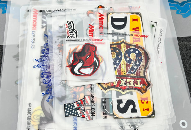 Mimaki TxF Series DTF printers—including TxF150-75, TxF300-75, and TxF300-1600—shown producing vibrant textile transfers with advanced features like white ink circulation (MCTv2), degassed ink packs, nozzle recovery, and ECO PASSPORT-certified PHT50 pigment inks—ideal for consistent, skin-safe printing on T-shirts, sportswear, and custom garments at high production speeds